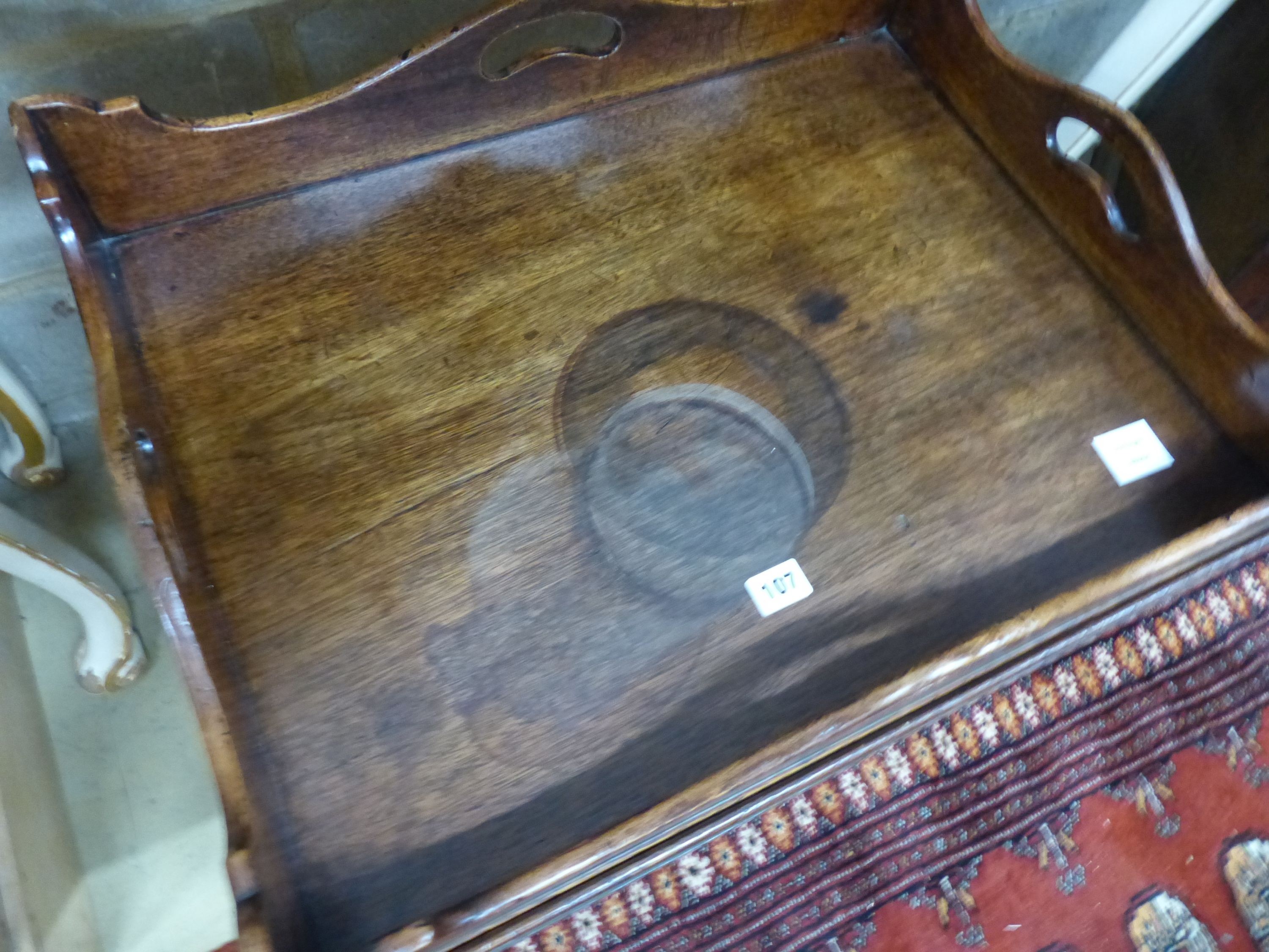 A 19th century rectangular mahogany butler’s tray occasional table, on associated stand, W.64cm D.49cm H.58cm (a.f.)